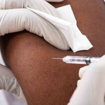 Close Up Person Getting A Vaccine Injection 244160917